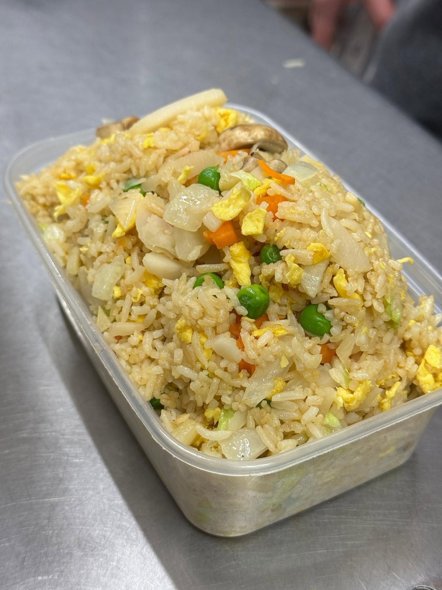 Vegetable fried rice with peas, carrots and mushrooms
